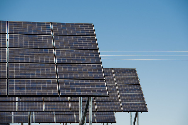 Large solar arrays in front of a blue sky at Wild Horse Wind and Solar Facility.